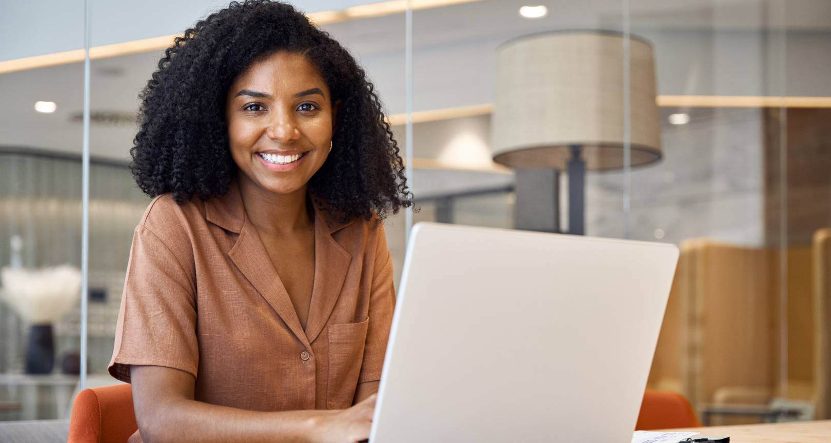 Person using laptop with email icons